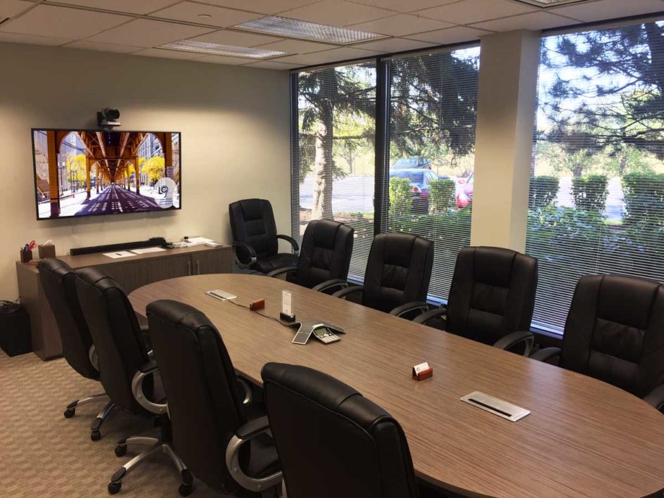 10-person conference room with video conferencing at Lake Cook Reporting.
